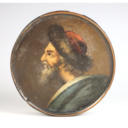 274 - A black lacquered papier mache portrait snuff box and cover, 19th century, the cover painted with a ... 