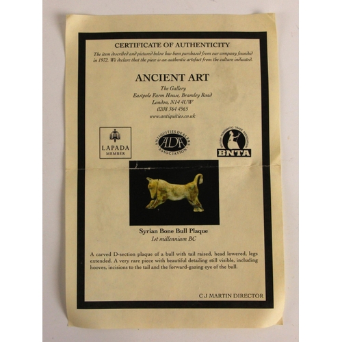 277 - An Assyrian carved bone plaque, 1st Millennium BC, carved as a bull modelled standing with its tail ... 