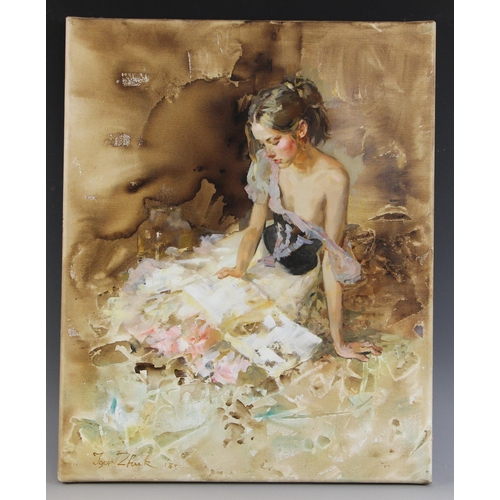 295 - Igor Zhuk (Ukrainian, contemporary),  
A seated woman reading in an artist's studio,  
Oil on canvas... 