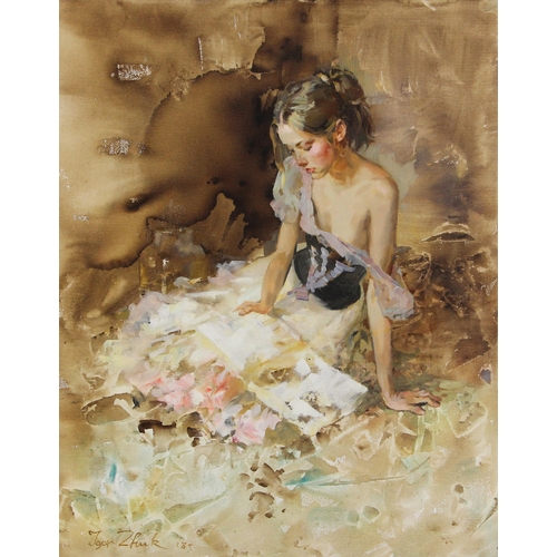 295 - Igor Zhuk (Ukrainian, contemporary),  
A seated woman reading in an artist's studio,  
Oil on canvas... 