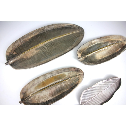 126 - An early 20th century set of three Liberty dishes, the banana leaf shaped dishes stamped 'Liberty' t... 