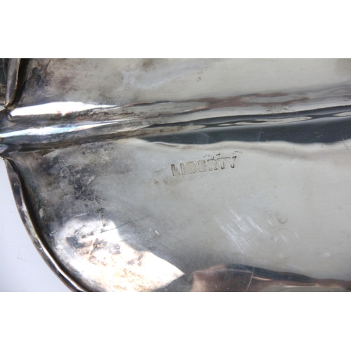 126 - An early 20th century set of three Liberty dishes, the banana leaf shaped dishes stamped 'Liberty' t... 