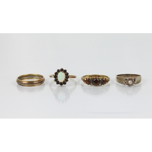 179 - A collection of seven yellow metal dress rings, including a late 20th century diamond solitaire, hal... 