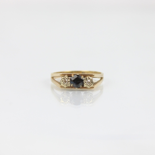 217 - A late 20th century sapphire and diamond three stone ring, the central sapphire with diamond set to ... 