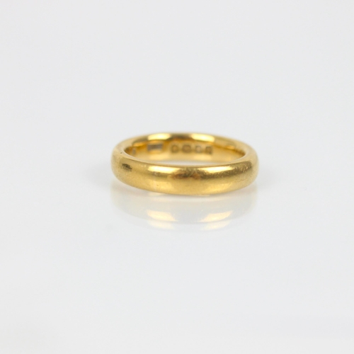 261 - A 22ct yellow gold wedding band, stamped possibly 'ACC' Birmingham, possibly 1924, ring size J, 7.2g... 