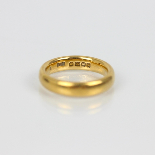 261 - A 22ct yellow gold wedding band, stamped possibly 'ACC' Birmingham, possibly 1924, ring size J, 7.2g... 
