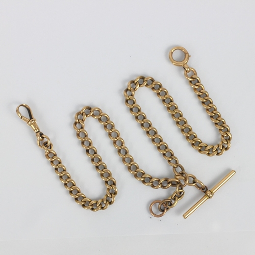 263 - An early 20th century yellow metal watch chain, the curb link chain stamped '15.625' suspending a 'T... 