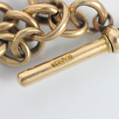 263 - An early 20th century yellow metal watch chain, the curb link chain stamped '15.625' suspending a 'T... 