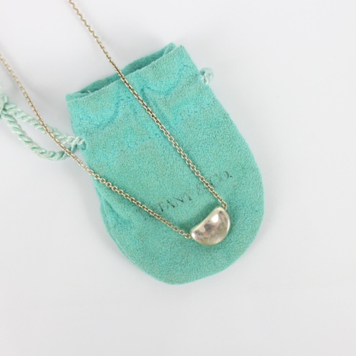 264 - A Tiffany and Co 'Bean' silver necklace, designed by Elsa Peretti, the bean shaped pendant stamped t... 