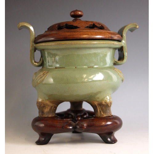 439 - A large Chinese Longquan celadon glazed incense burner, the koro of cauldron form with two scroll ha... 