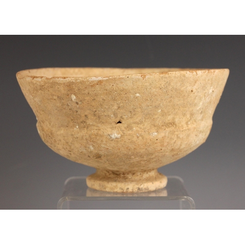 451 - An Ancient terracotta bowl, Holy Land, circa 1400-1200 BC, the footed bowl of circular and waisted f... 