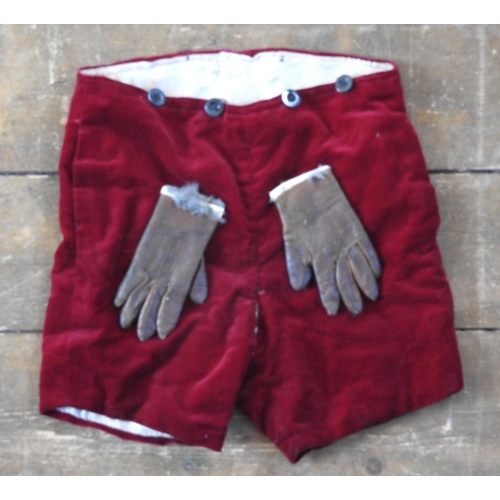 478 - A small boy's burgundy velvet jacket and two pair of matching shorts, first quarter of the 20th cent... 