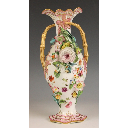 408 - An English porcelain florally encrusted stem vase, mid 19th century, of ovoid form with flared neck ... 