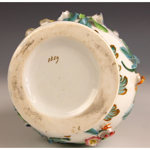 408 - An English porcelain florally encrusted stem vase, mid 19th century, of ovoid form with flared neck ... 