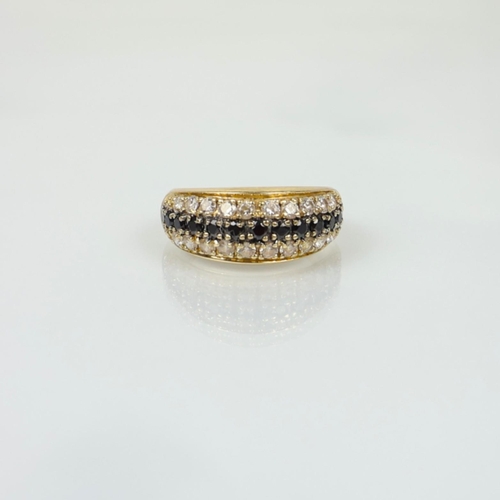 A yellow metal sapphire dress ring, the central border of sapphires ...