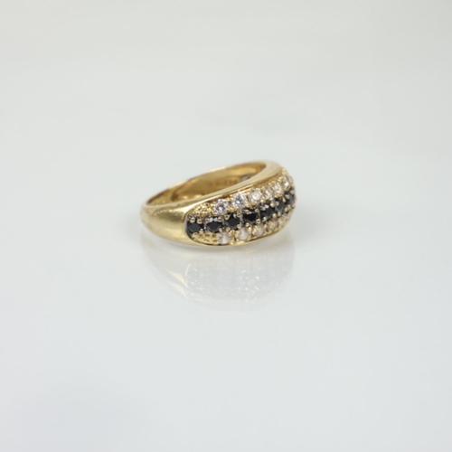A yellow metal sapphire dress ring, the central border of sapphires ...