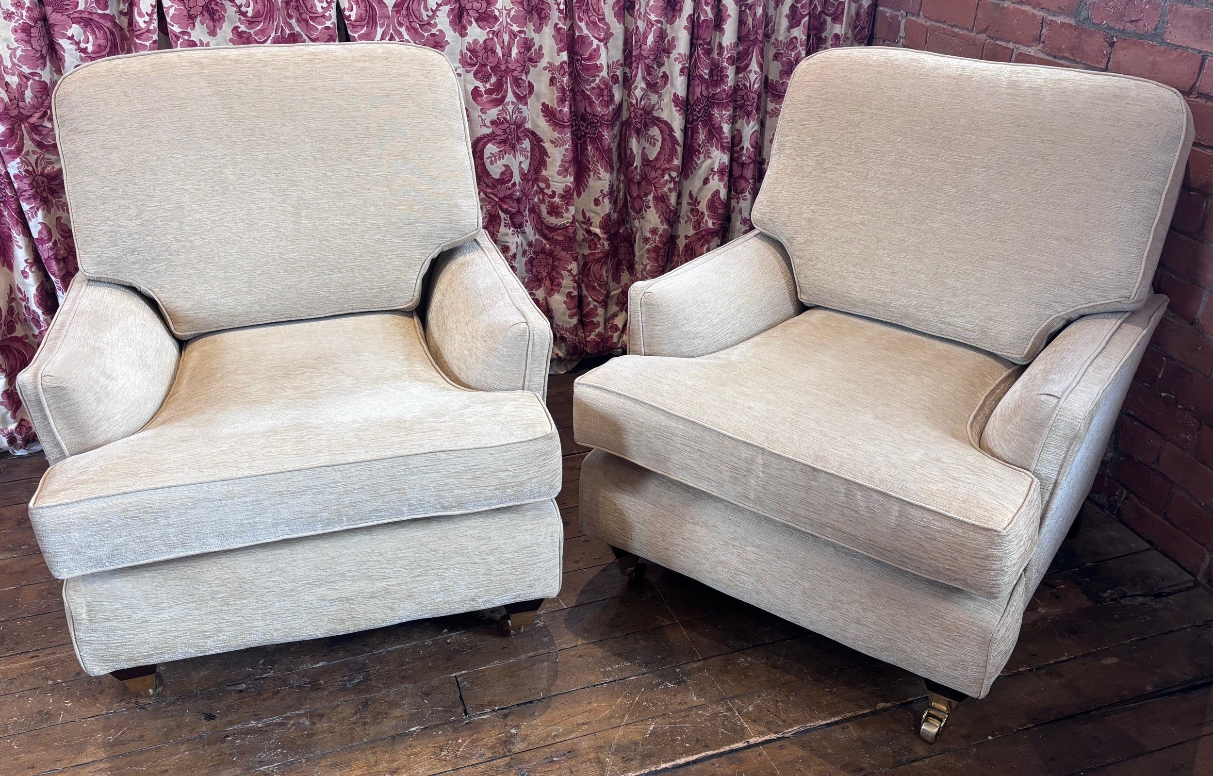 A pair of contemporary Multiyork armchairs, upholstered in cream ...