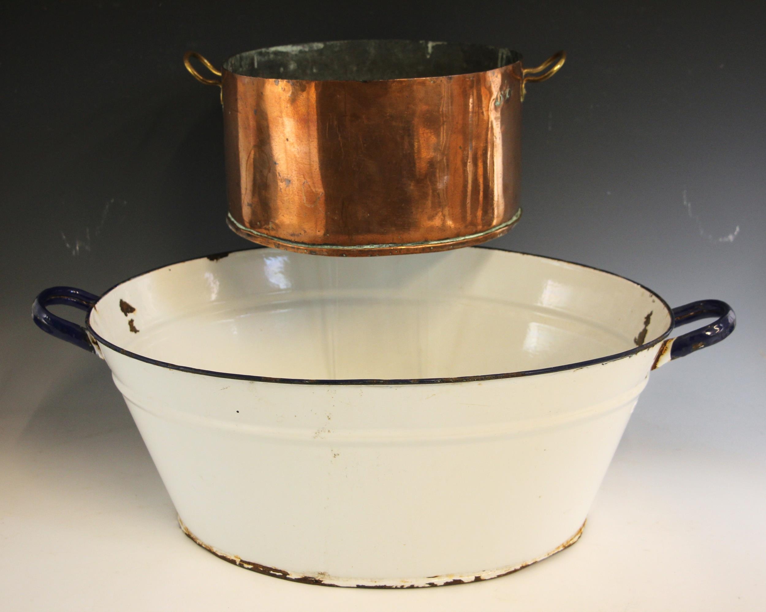 A Victorian twin handled copper cooking pot of country house ...