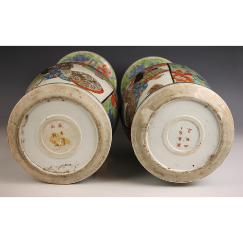592 - A pair of Japanese porcelain vases, Meiji Period (1868-1912), each baluster shaped vase decorated ag... 