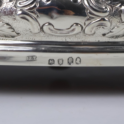 60 - A George IV silver cruet stand, J E Terrey & Co, London 1820, the acanthus capped handle above eight... 