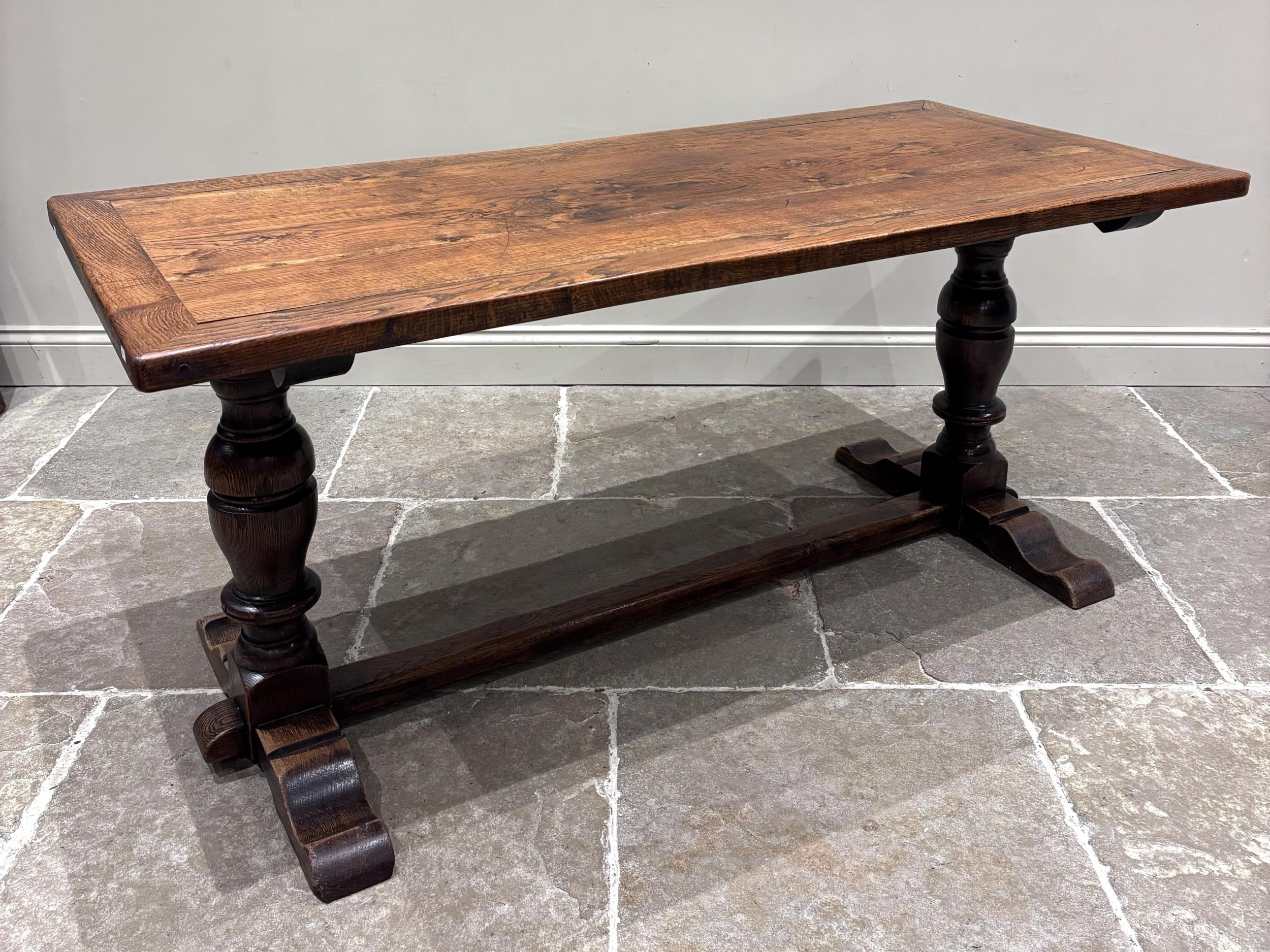 A 19th century and later oak refectory table, the rectangular plank top ...