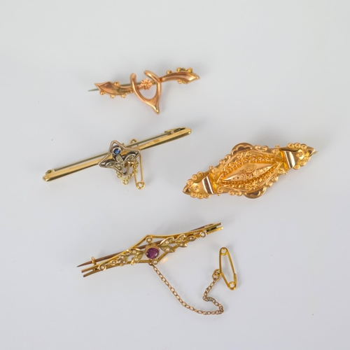 101 - A group of four early 20th century yellow metal brooches, including a lozenge shaped example, marked... 