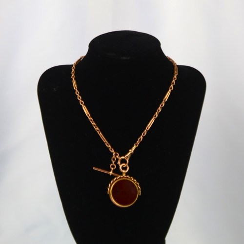 111A - An early 20th century 9ct gold watch chain, the fancy link chain with interlocking and rope twist de... 