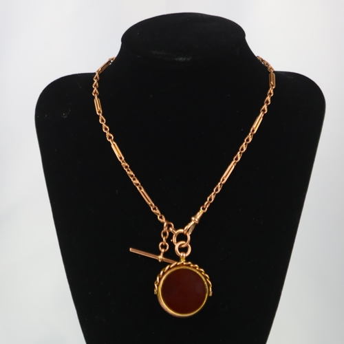 111A - An early 20th century 9ct gold watch chain, the fancy link chain with interlocking and rope twist de... 