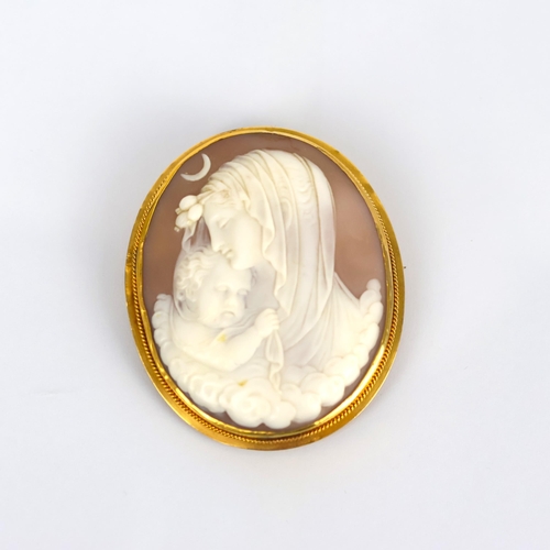 115 - A 19th century Italian cameo brooch, the central oval depiction of the Madonna with child, within a ... 