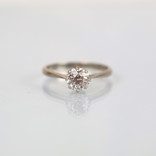116 - An early 20th century diamond solitaire, the old cut diamond within white metal claw setting, leadin... 