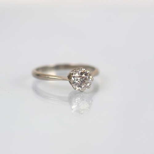 116 - An early 20th century diamond solitaire, the old cut diamond within white metal claw setting, leadin... 
