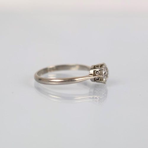 116 - An early 20th century diamond solitaire, the old cut diamond within white metal claw setting, leadin... 