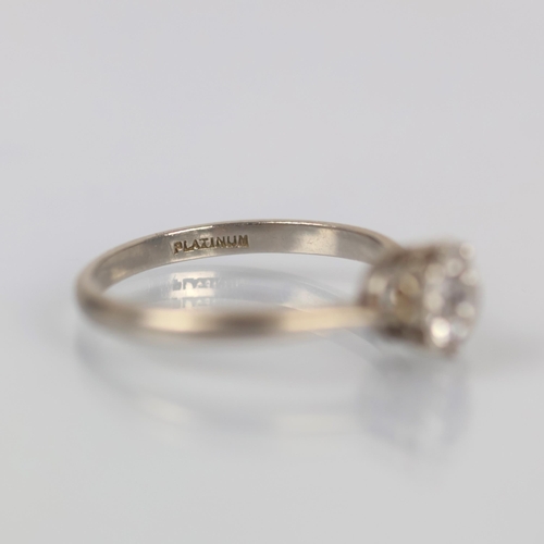 116 - An early 20th century diamond solitaire, the old cut diamond within white metal claw setting, leadin... 