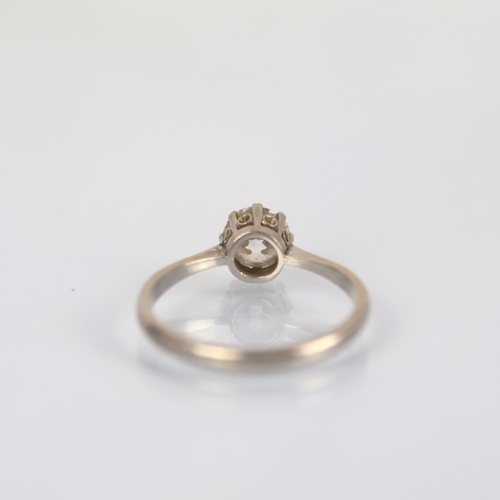 116 - An early 20th century diamond solitaire, the old cut diamond within white metal claw setting, leadin... 