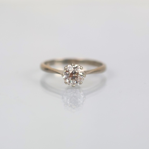 116 - An early 20th century diamond solitaire, the old cut diamond within white metal claw setting, leadin... 