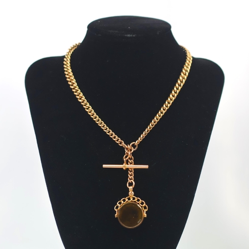 117 - An early 20th century style 9ct watch chain, the graduated curb links stamped '9.375' suspending two... 