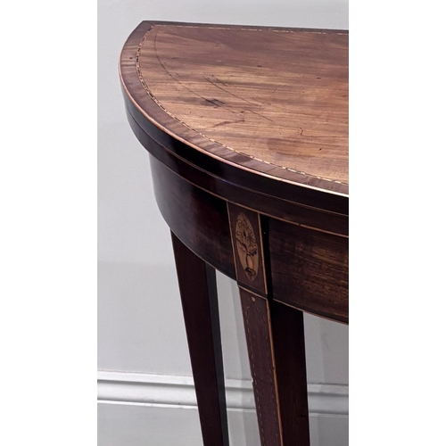 550 - A Regency mahogany and satinwood inlaid demi-lune tea table, the fold-over top raised on four legs o... 