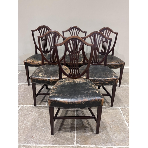 551 - A set of six George III Hepplewhite style mahogany dining chairs, each with worn leather and studded... 