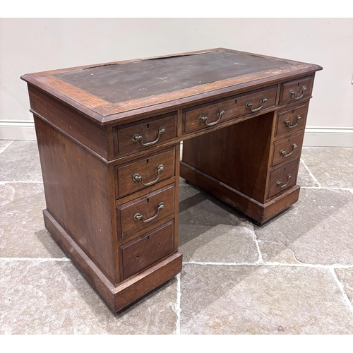 589 - A late Victorian oak pedestal desk, the rectangular top with leather inset skiver with three frieze ... 