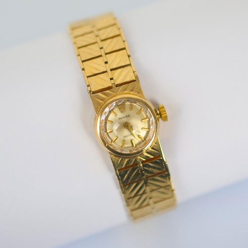85 - A ladies 9ct gold Rolex Precision wristwatch, the circular silver coloured dial with baton markers, ... 