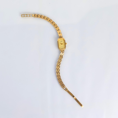 94 - A ladies 9ct gold Rotary quartz wristwatch, the shaped rectangular face with baton markers, set in p... 