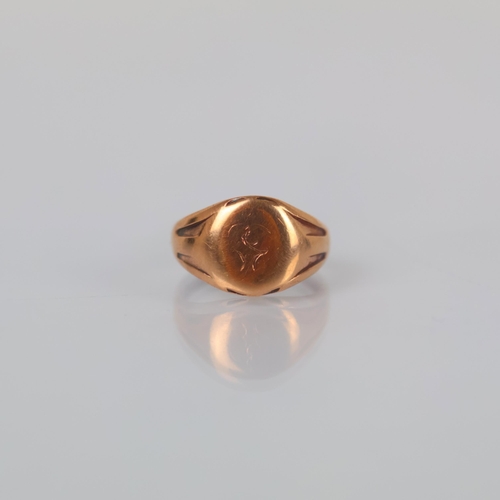 97 - An early 20th century 9ct gold signet ring, the oval head leading to tapering shank, hallmarked to i... 