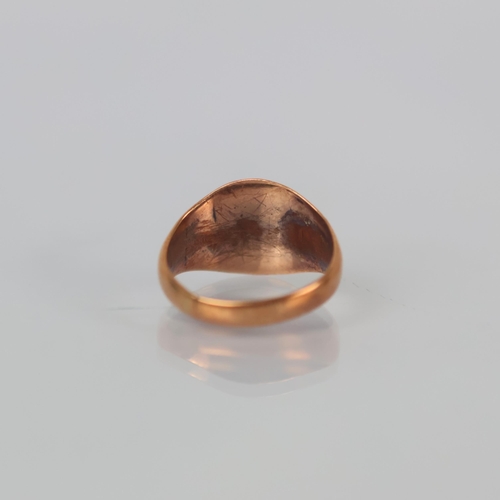 97 - An early 20th century 9ct gold signet ring, the oval head leading to tapering shank, hallmarked to i... 
