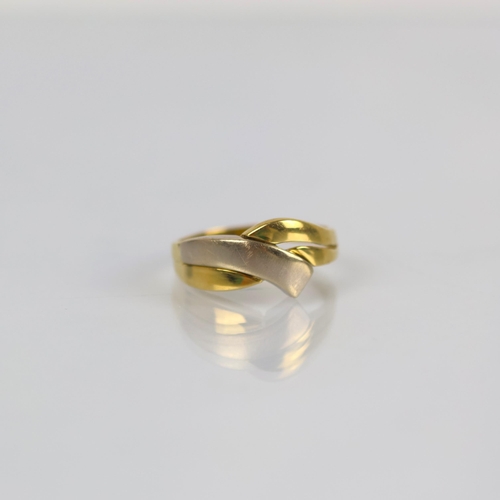 98 - A late 20th century two tone ring, the organically shaped head with openwork and two tone detail, le... 