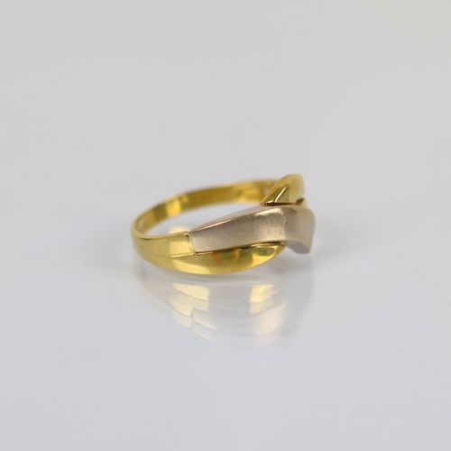 98 - A late 20th century two tone ring, the organically shaped head with openwork and two tone detail, le... 