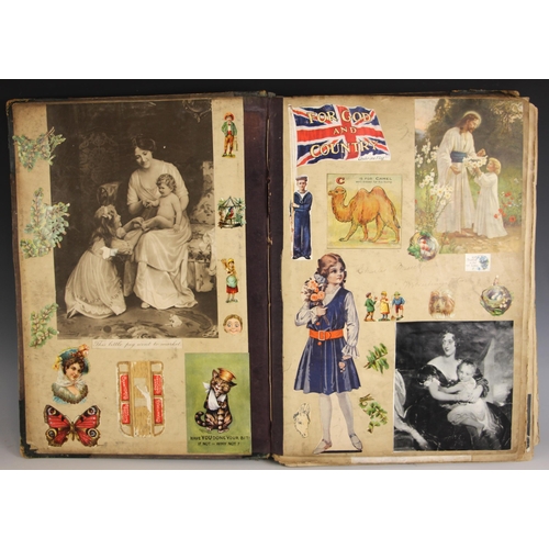 385 - A scrapbook of large proportions, early 20th century, to include a pasted down Louis Wain postcard, ... 