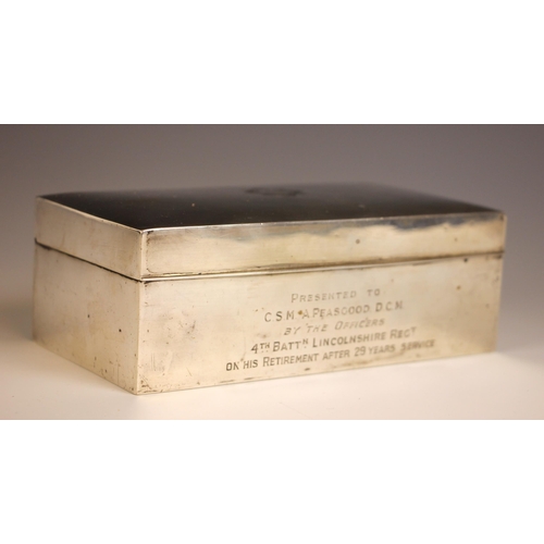 28 - MILITARY INTEREST: A George V silver cigarette box, Sanders & Mackenzie, Birmingham 1928, of rectang... 