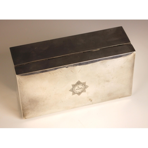 28 - MILITARY INTEREST: A George V silver cigarette box, Sanders & Mackenzie, Birmingham 1928, of rectang... 