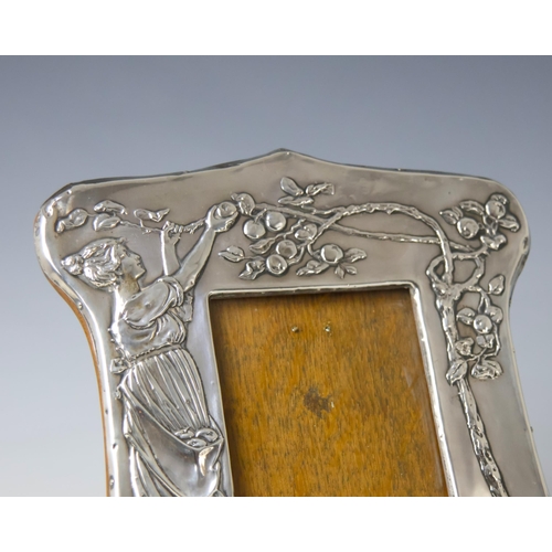 35 - An Edwardian silver mounted photograph frame, Charles S Green & Co Ltd, Birmingham 1904, the Arts an... 