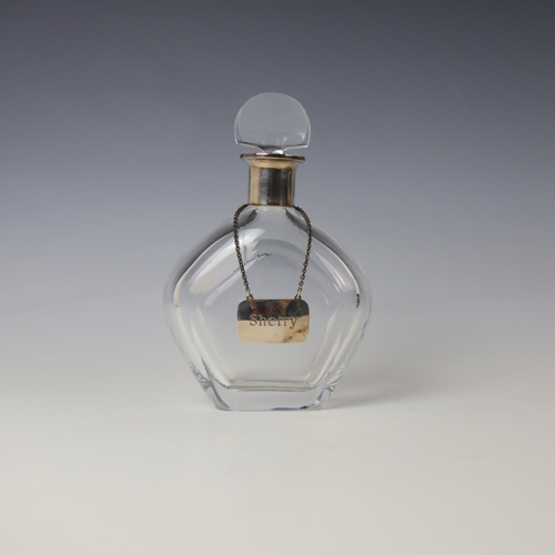 29 - A continental white metal mounted glass decanter, the semi circle glass stopper above plain polished... 